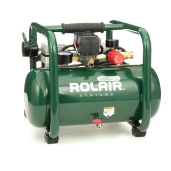 A green Rolair air compressor with a carrying handle and pressure gauges.