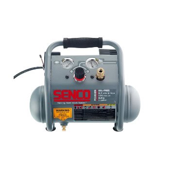 Portable air compressor with gauges, handle, and warning labels.