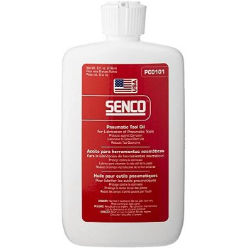 A white bottle of Senco pneumatic tool oil with red and white label, featuring product details and usage instructions.