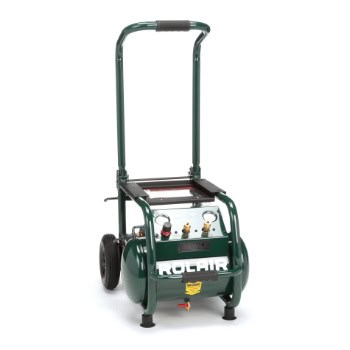 Green portable air compressor on wheels with a handle, featuring controls and gauges on the front.